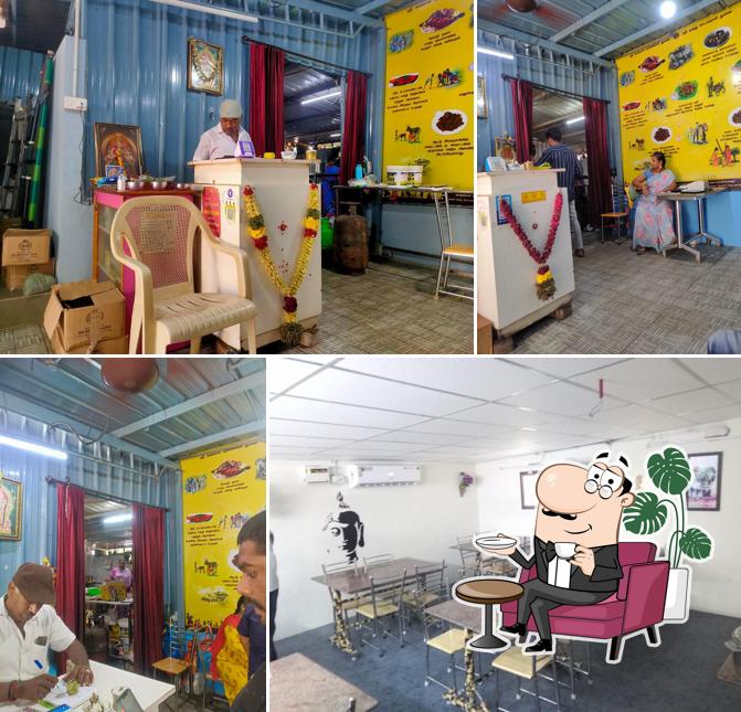 Take a seat at one of the tables at Kiramathu Adupangarai Veg/Non-veg