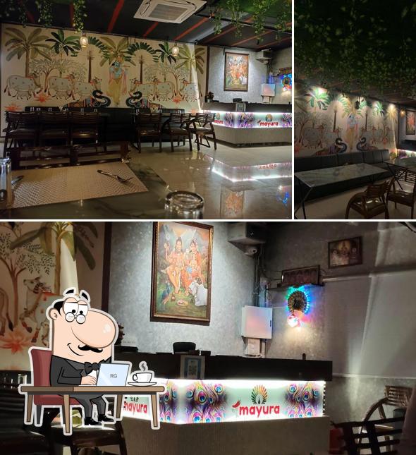 The interior of Mayura Pure Veg Restaurant