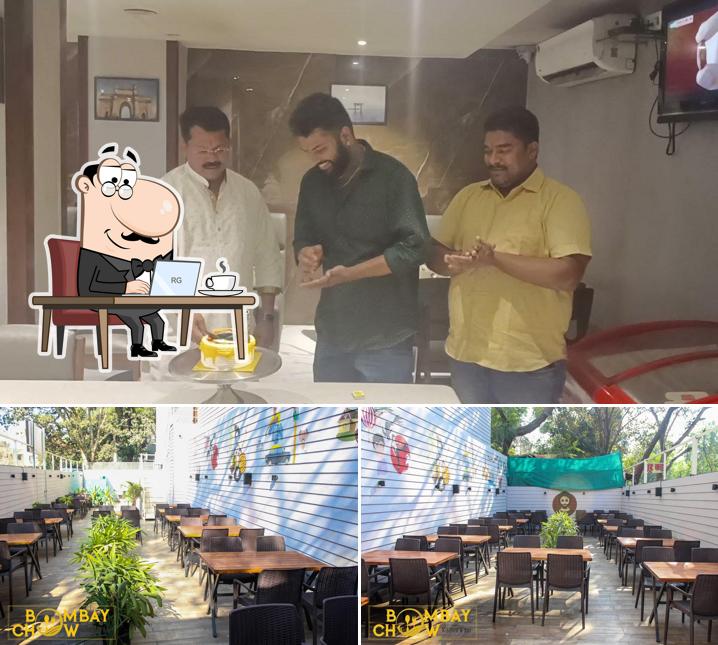 Take a seat at one of the tables at Hotel Bombay Chow family rest o Bar