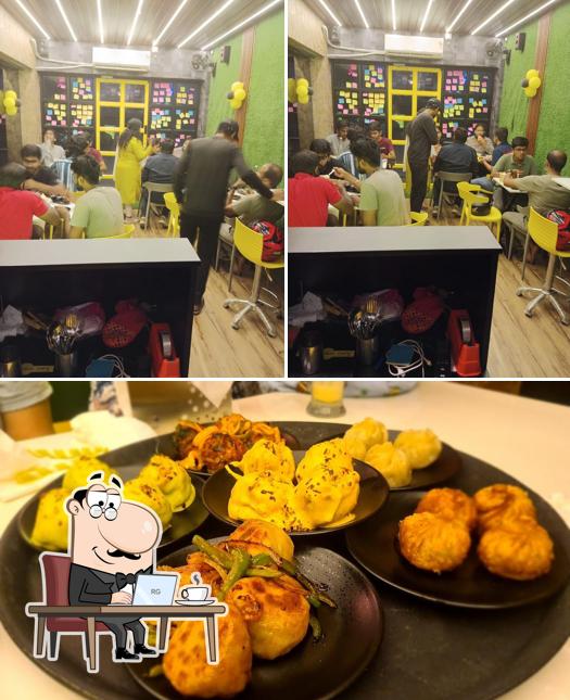 Take a look at the picture displaying interior and beverage at Momo magic cafe