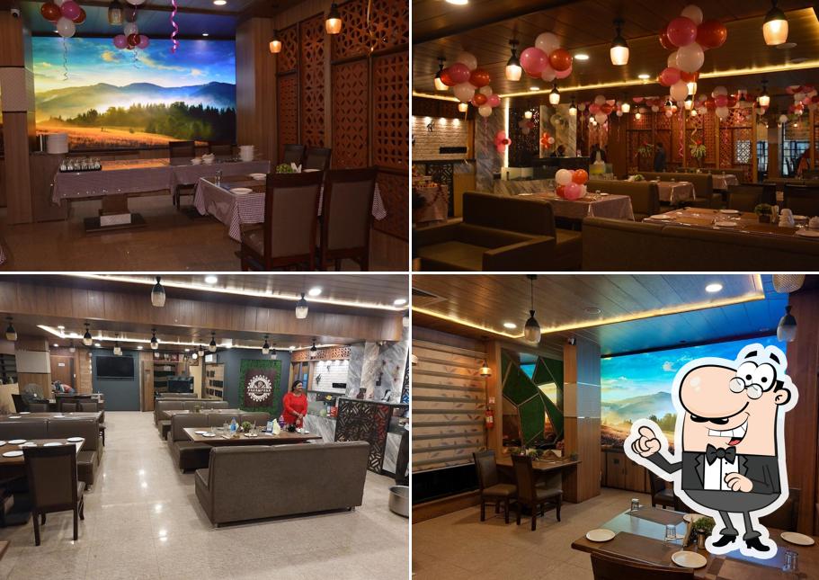 Take a seat at one of the tables at Parampara Veg Restaurant