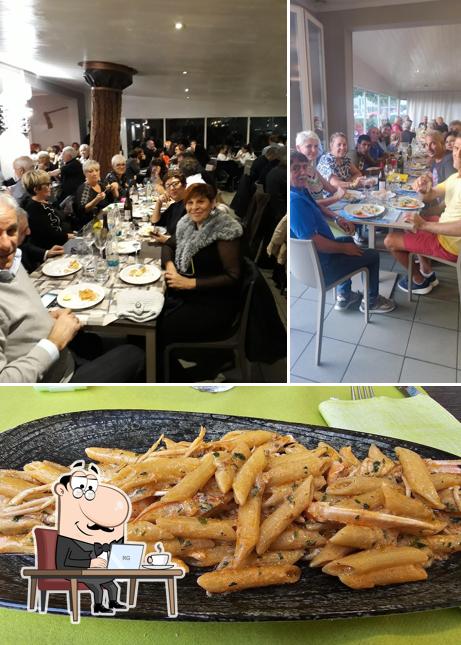 La foto della interni e cibo di Ristorante Pizzeria Papema Beach