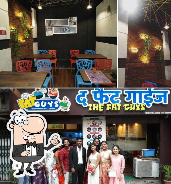 Take a seat at one of the tables at The Fat Guys