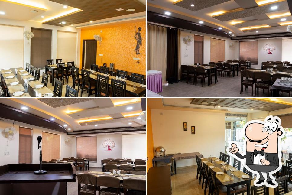 Take a seat at one of the tables at Hotel Mukund Villas
