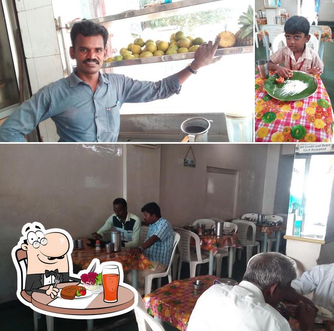 This is the photo showing dining table and food at Hotel Ramakrishna Bhavan