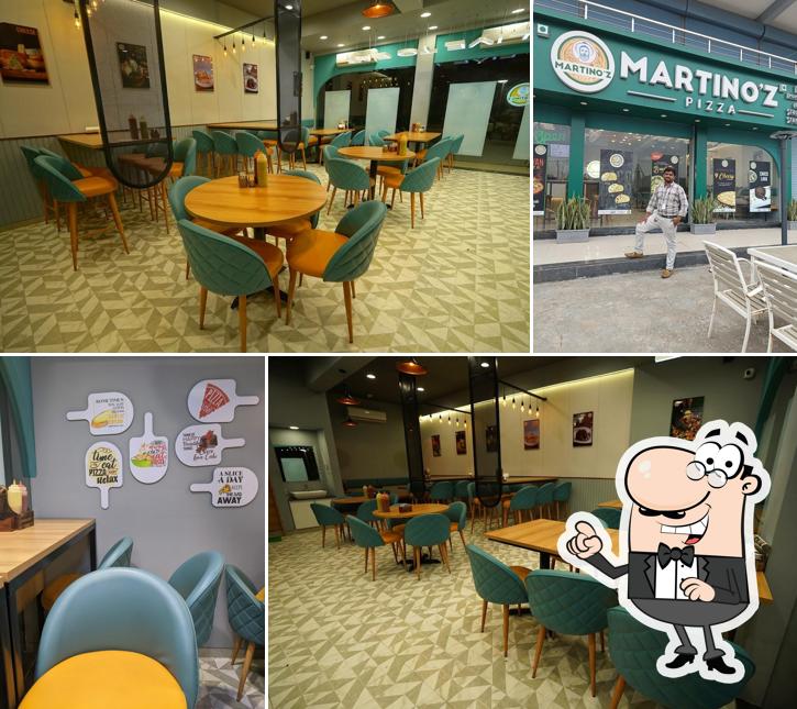 Take a seat at one of the tables at Martino'z Pizza