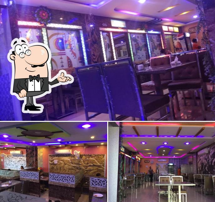 Take a seat at one of the tables at Balaji Santosh Family Dhaba