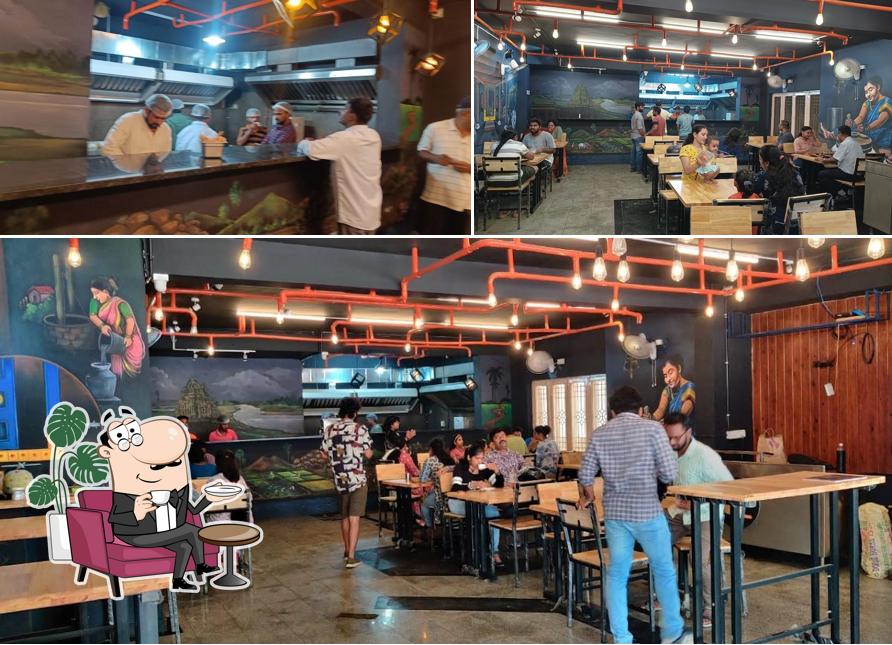 Take a seat at one of the tables at Palleturi Dosa - HSR