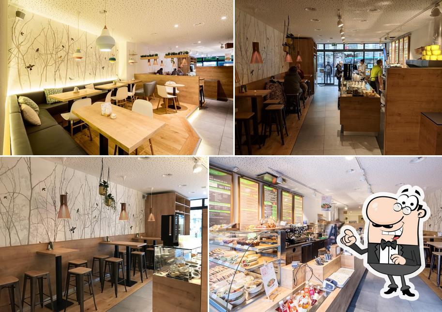 Gli interni di dean&david Bowls, Salate, Curries & Snacks am Bahnhof SSB Basel