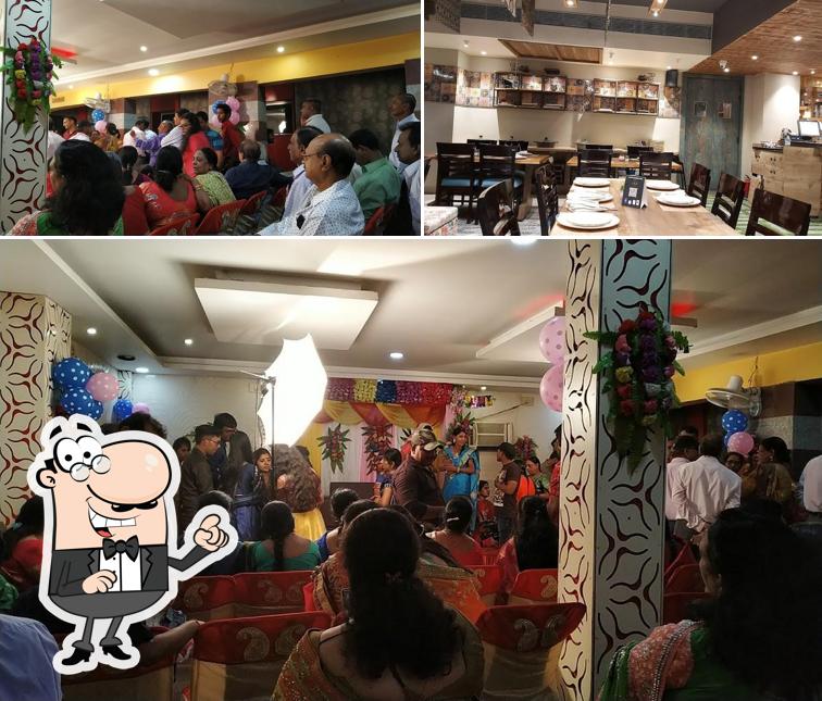 Take a seat at one of the tables at Amba Family Restaurant