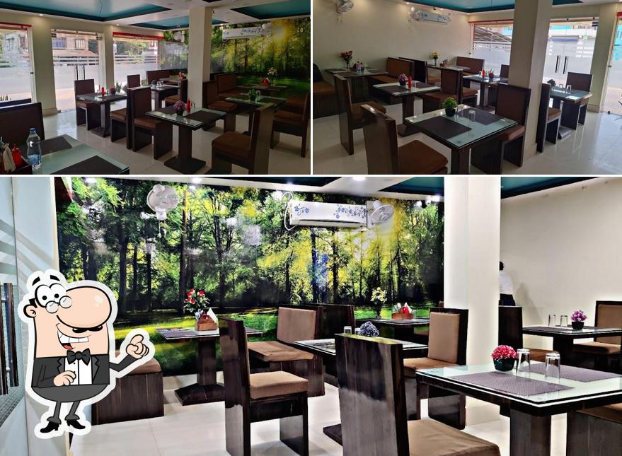 Take a seat at one of the tables at Food Garden (Bangalaxmi)