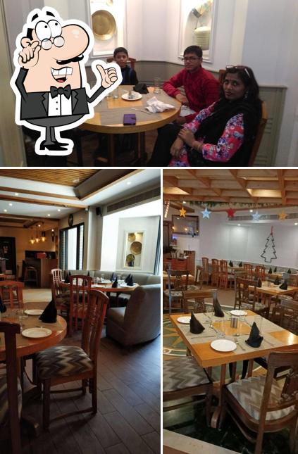 Take a seat at one of the tables at The Clay Oven Restaurant