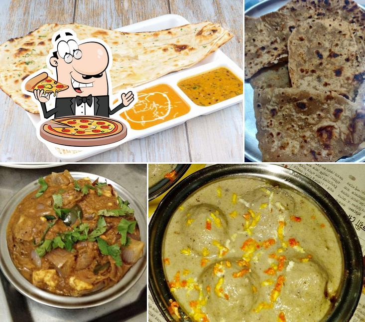 Try out pizza at Ambica Pride