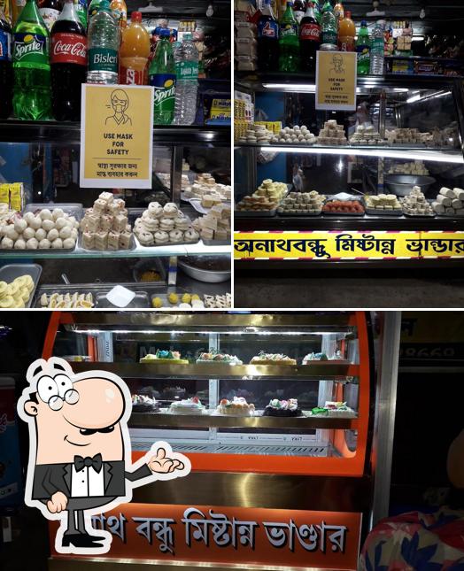 Take a look at the image displaying interior and beer at Anath Bandhu Mistanno Bhandar