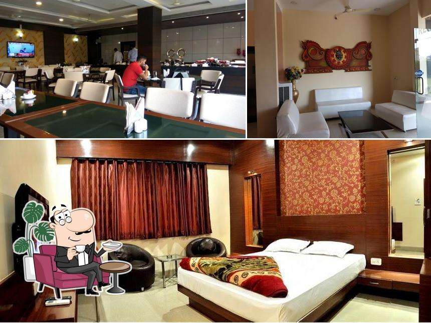 Take a seat at one of the tables at Hotel Shri Khedapati International