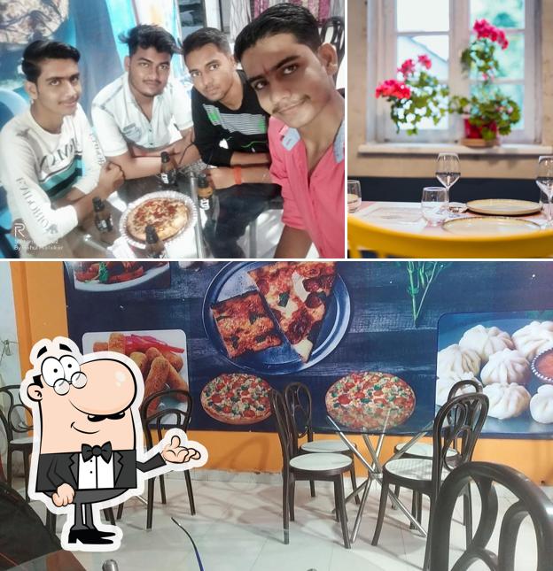 Among various things one can find interior and beverage at Delicious the pizza house