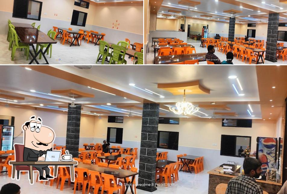 Take a seat at one of the tables at HOTEL PANCHAVATI