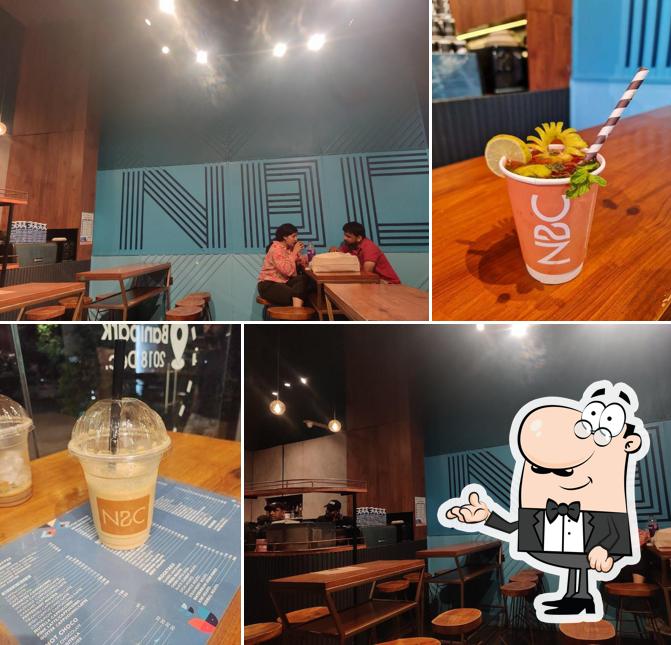 Take a seat at one of the tables at Nothing Before Coffee- New Palasia, Indore