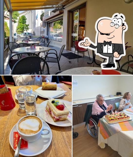 Siediti a un tavolo di Konditorei Stofner Cafè