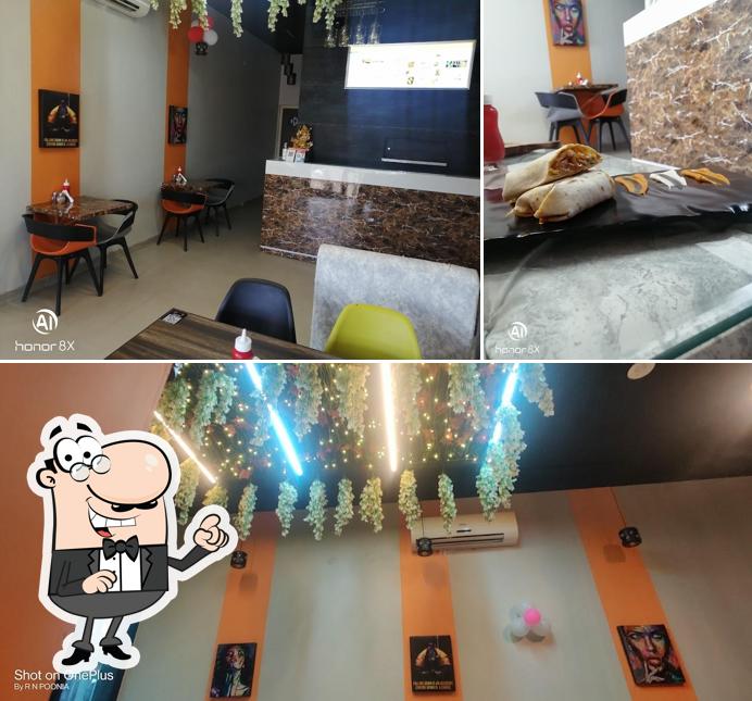 This is the photo depicting interior and food at Hunger Street