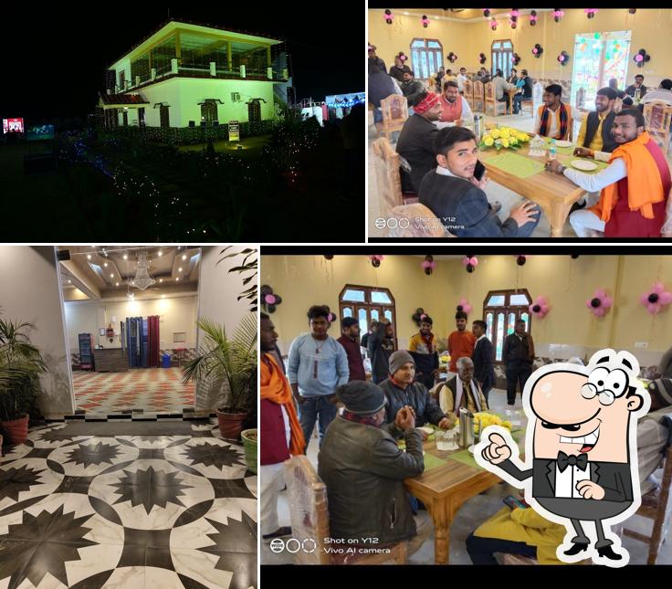 Take a seat at one of the tables at HANUMAN VATIKA RESTAURANT