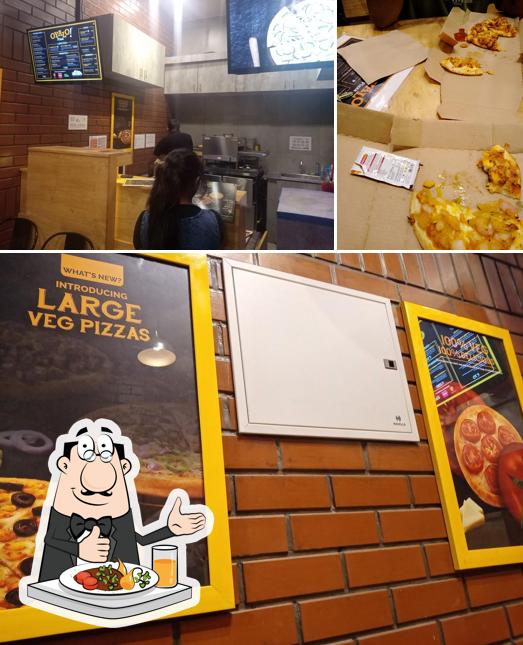 Take a look at the photo displaying food and interior at Oyalo pizza kumbakonam