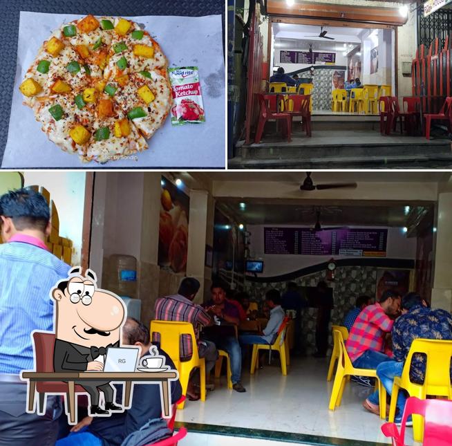 Check out the photo displaying interior and pizza at Roll House Point