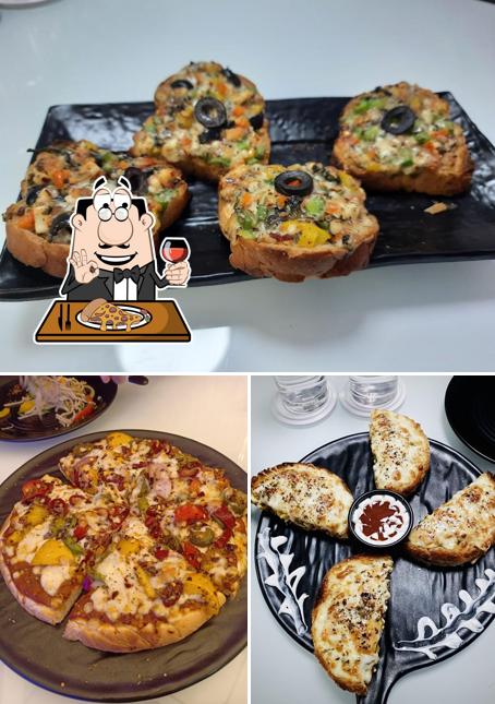 Order pizza at Elemental Cafe & Restaurant