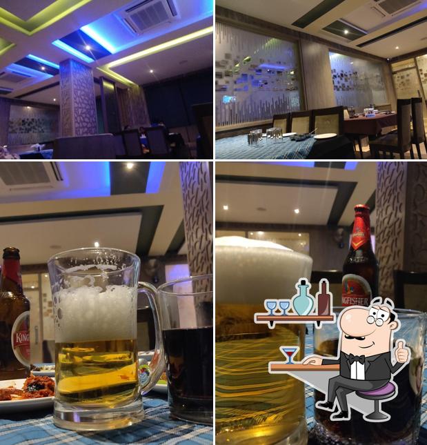 This is the picture displaying interior and drink at Madira Family Restaurant & Bar