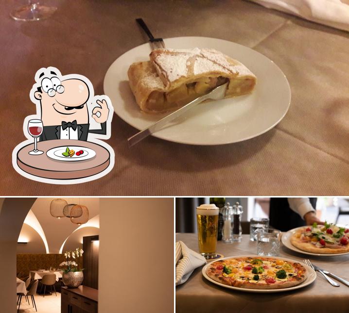 Tra le varie cose da Aida Restaurant Pizzeria si possono trovare la cibo e interni