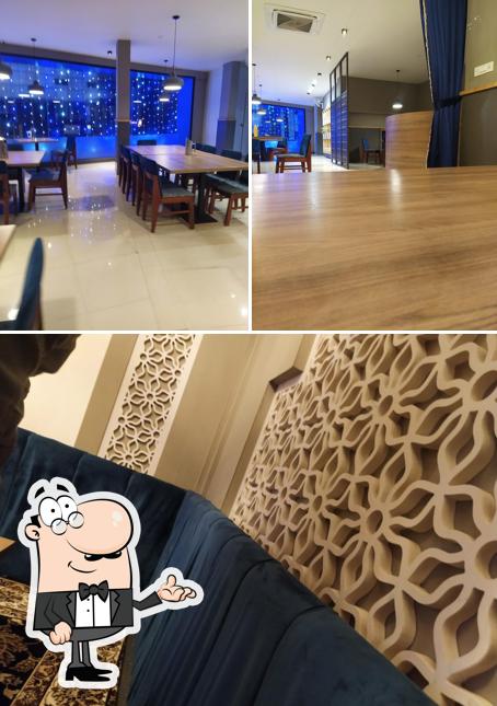 Take a seat at one of the tables at Muzwalla Grill & Mandi, Nilambur