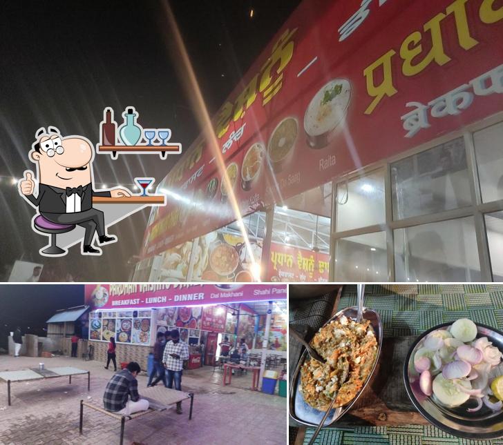 The photo of interior and pizza at Pardhaan vaishno Dhaba