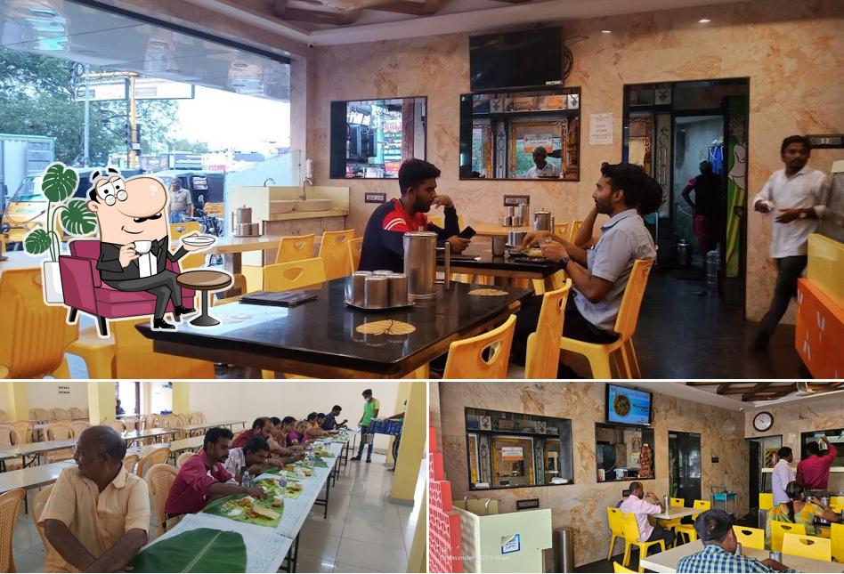 Take a seat at one of the tables at Thambu Restaurant