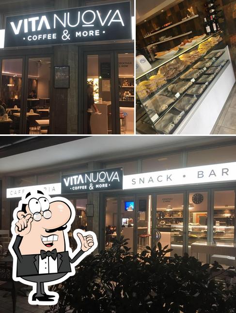 Questa è la immagine che presenta la interni e dolce di Vita Nuova Coffee & More