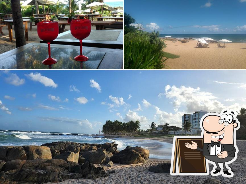 A ilustração do O Lôro Pedra do Sal: Barraca de Praia, Restaurante, Bar, Salvador BA’s exterior e bebida