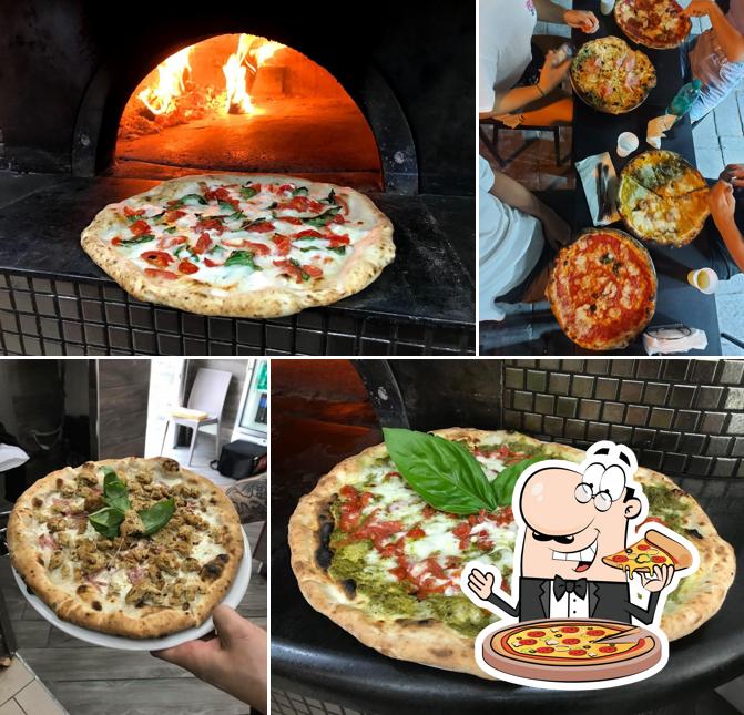 Prenditi una pizza a Pizzeria Hermanos