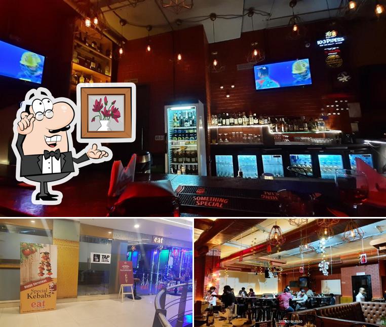Take a seat at one of the tables at Tap The Sports Bar