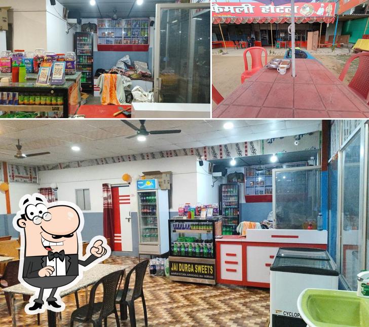 Take a seat at one of the tables at New Jai Maa Family Hotel