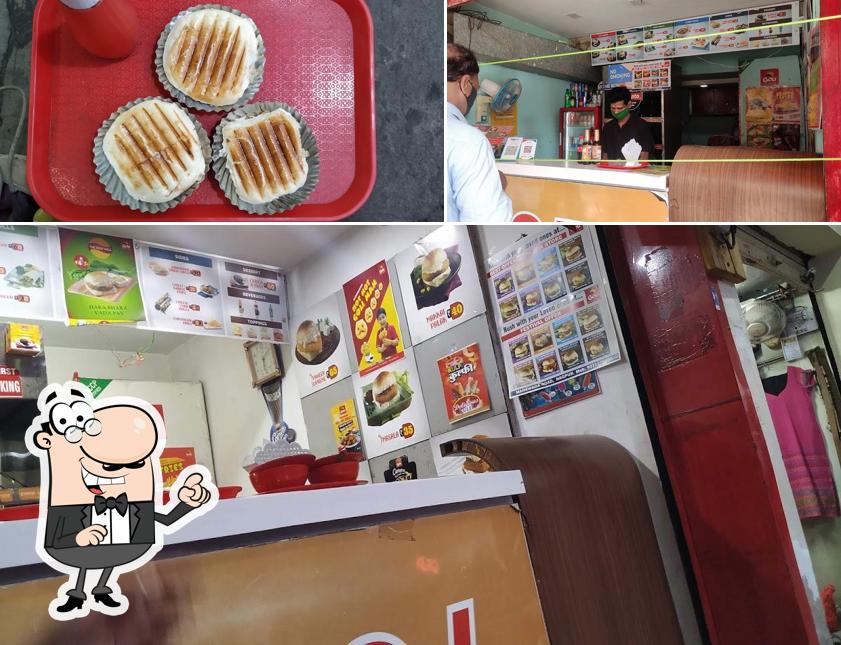 Check out the picture showing interior and food at Goli Vada Pav