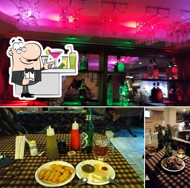The picture of bar counter and dining table at Kritika Restaurant And Bar