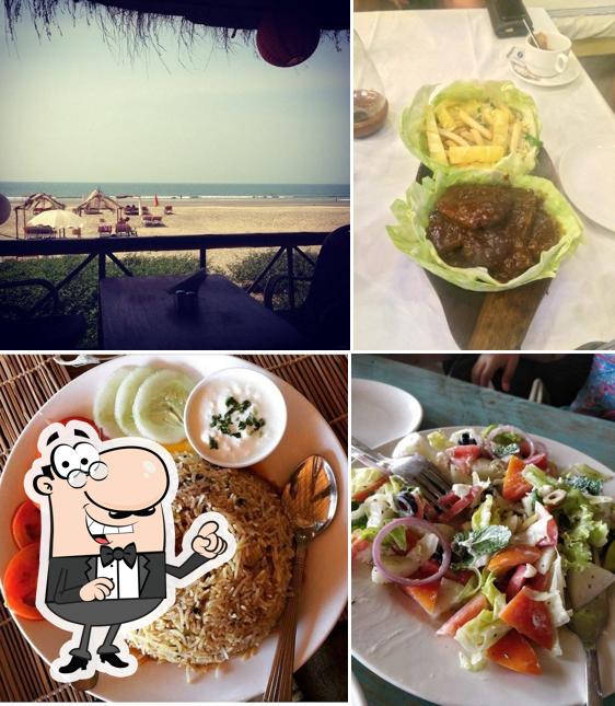 Take a seat at one of the tables at Lamore Beach Shack Restaurant