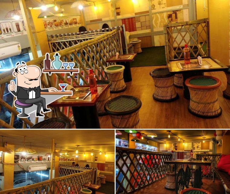 Take a seat at one of the tables at DHABA Cafe