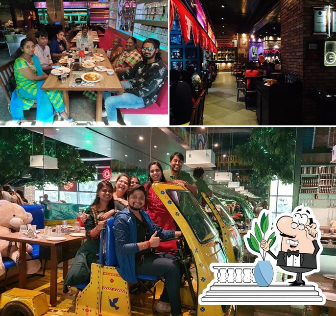 Check out the image displaying exterior and dining table at Nautanki Gali