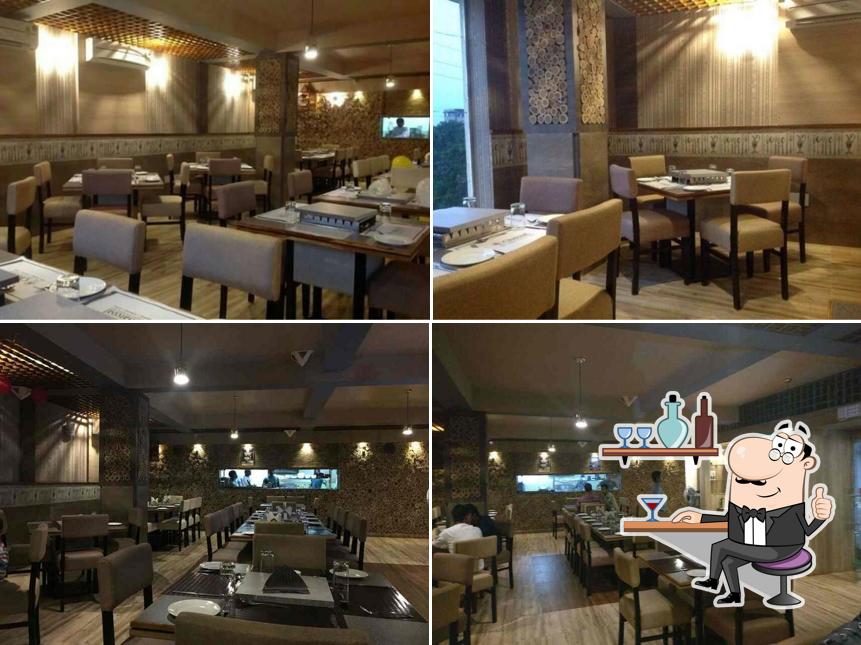 Take a seat at one of the tables at Charcoal Kitchen and Cafe