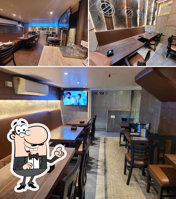Take a seat at one of the tables at Magnum Family Restaurant and Bar