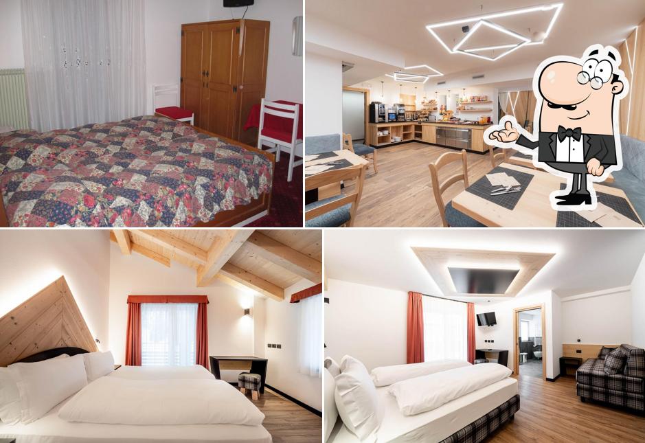 Siediti a un tavolo di Albergo Garnì Edy, B&B e ristorante pizzeria. Alba di Canazei, Val di Fassa