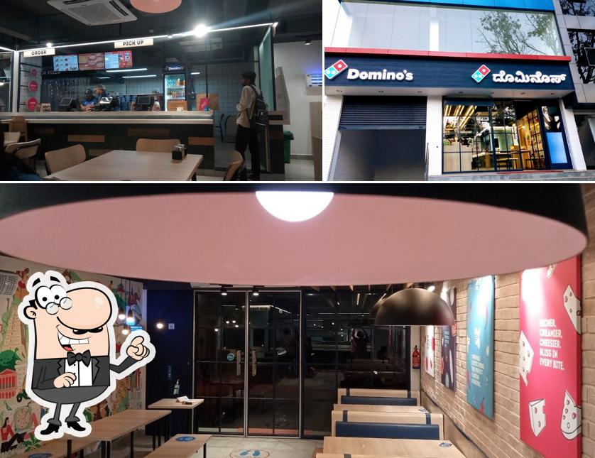 Take a seat at one of the tables at Domino's Pizza Vivekananda Nagar, Mysuru
