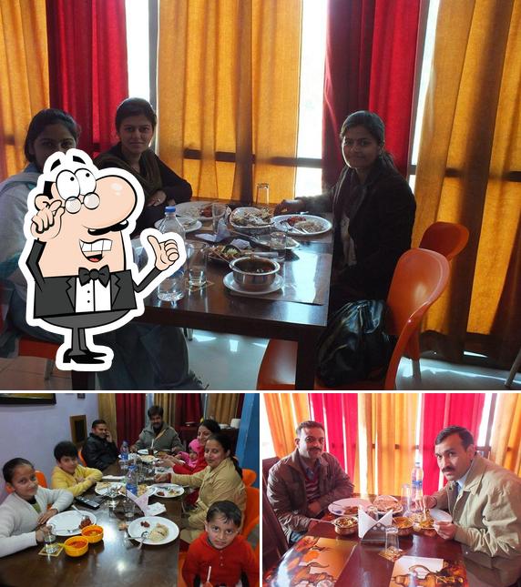 Take a seat at one of the tables at Khadke Glassi ,blue Waves,desi Tadka