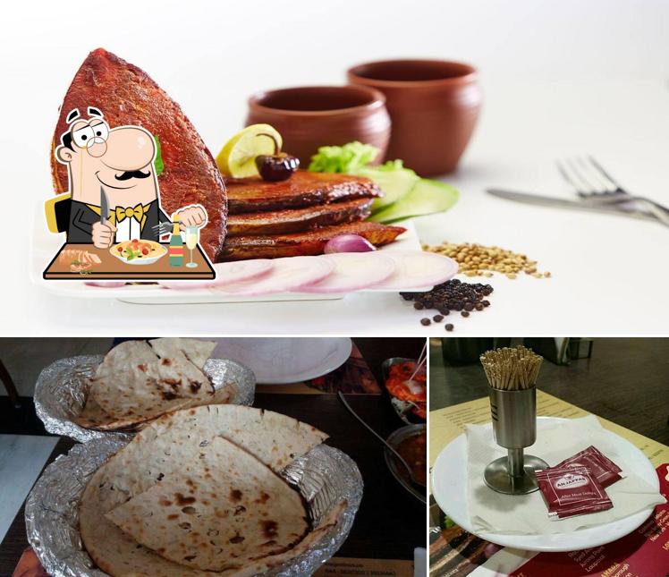 Check out the photo displaying food and dining table at Hotel Anjappar