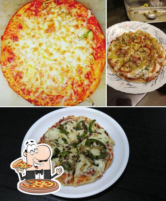Try out pizza at Yummy Cafe